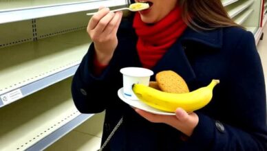 A woman, clad in a dark coat and a striking red scarf, was caught on camera in an almost-empty supermarket